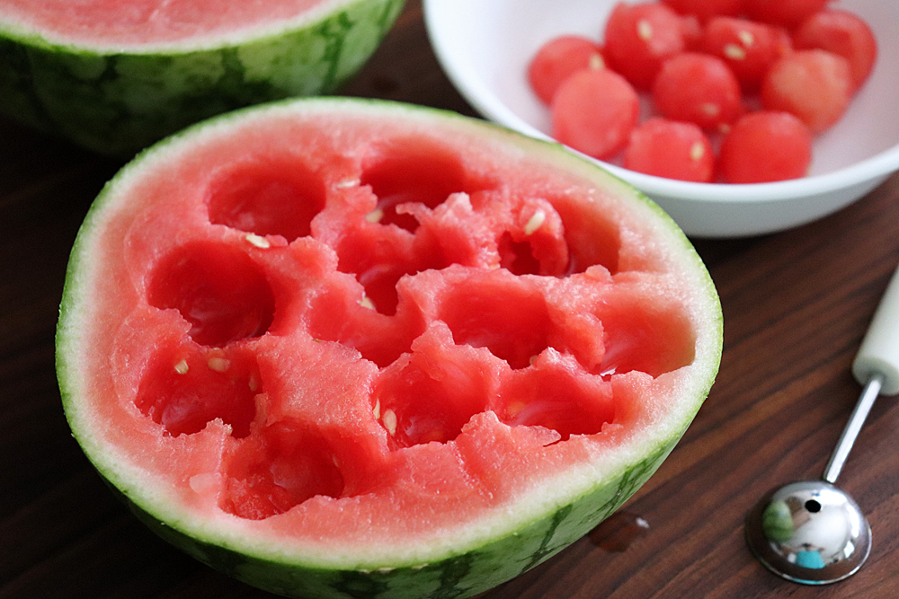 Scooping the watermelon into balls