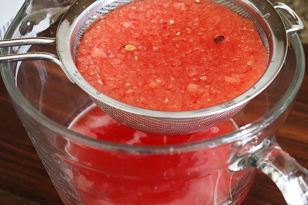 Straining the watermelon juice