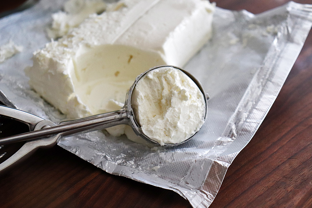 Using the same scoop, scoop from a block of cream cheese